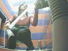 Hot babes emptying their bladders in mall toilet