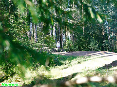 Shameless young blonde tart caught peeing on forest path