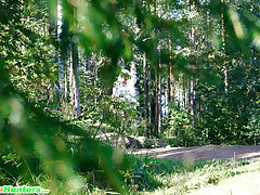 Naughty blonde pisses into a sandpit in forest