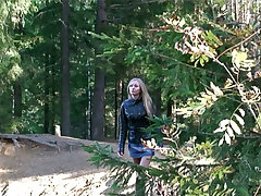 Beautiful blondie goes for a wee on an empty forest path