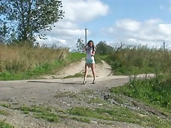 Raunchy teenage candy pees on an empty dirt road