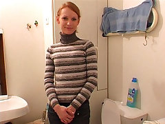 Amateur blondie gets filmed urinating in the loo