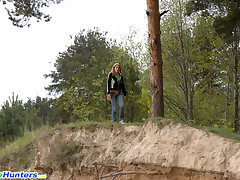 Beautiful teen plays watersports on a quiet forest glade